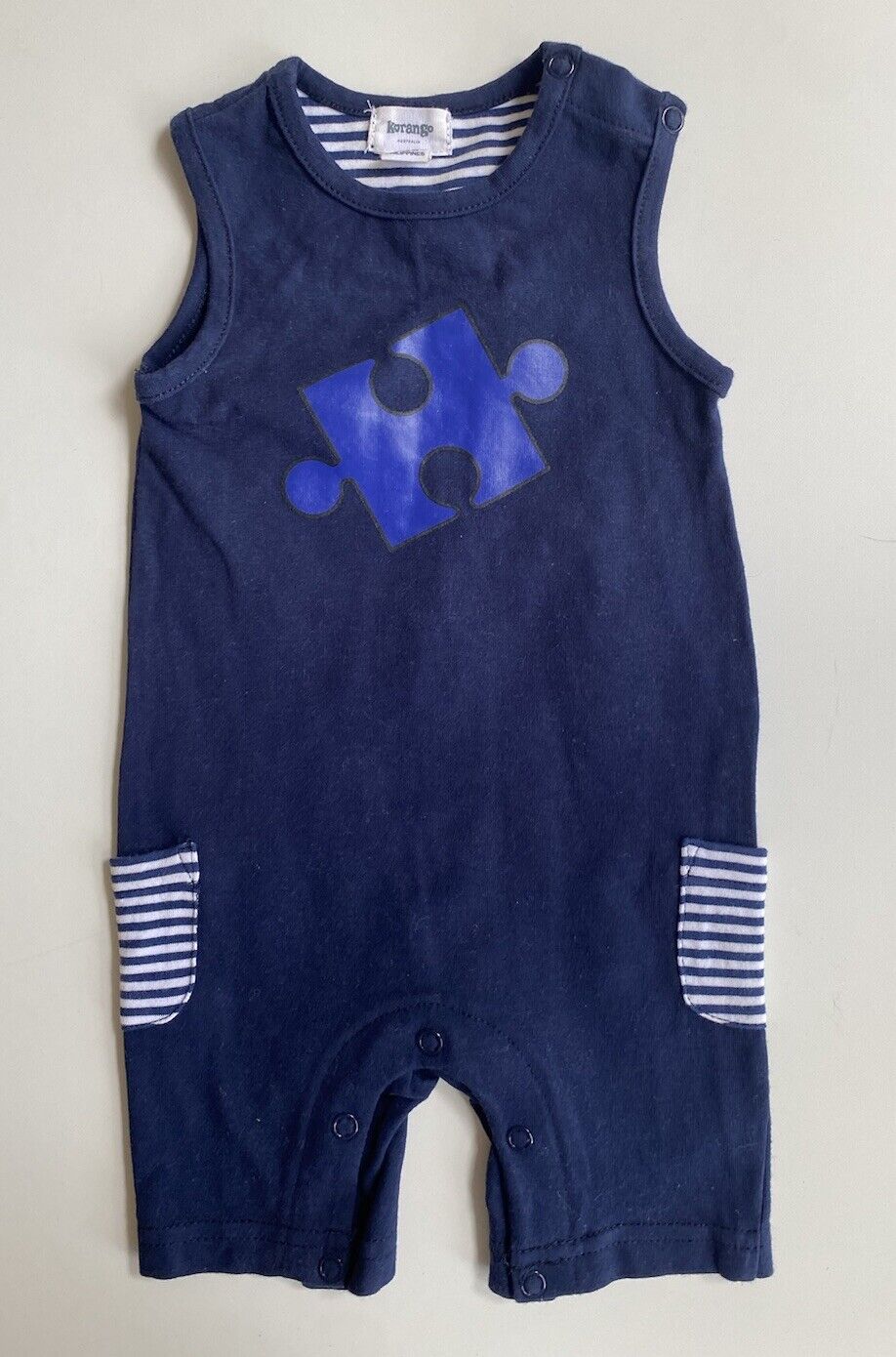 Korango baby size 3-6 months navy blue sleeveless one-piece puzzle piece, VGUC