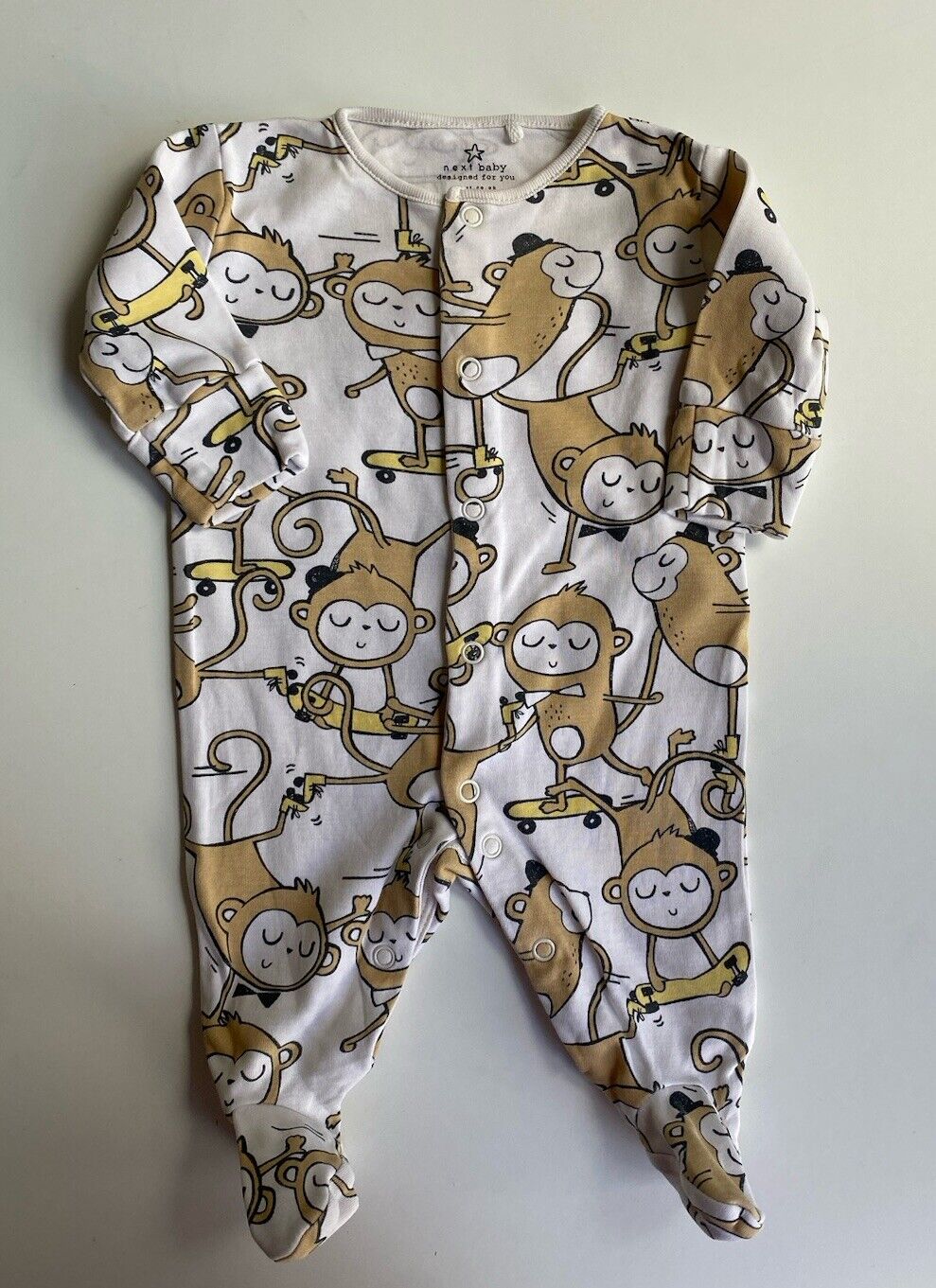 Next baby size newborn white one-piece skateboarding monkeys, VGUC