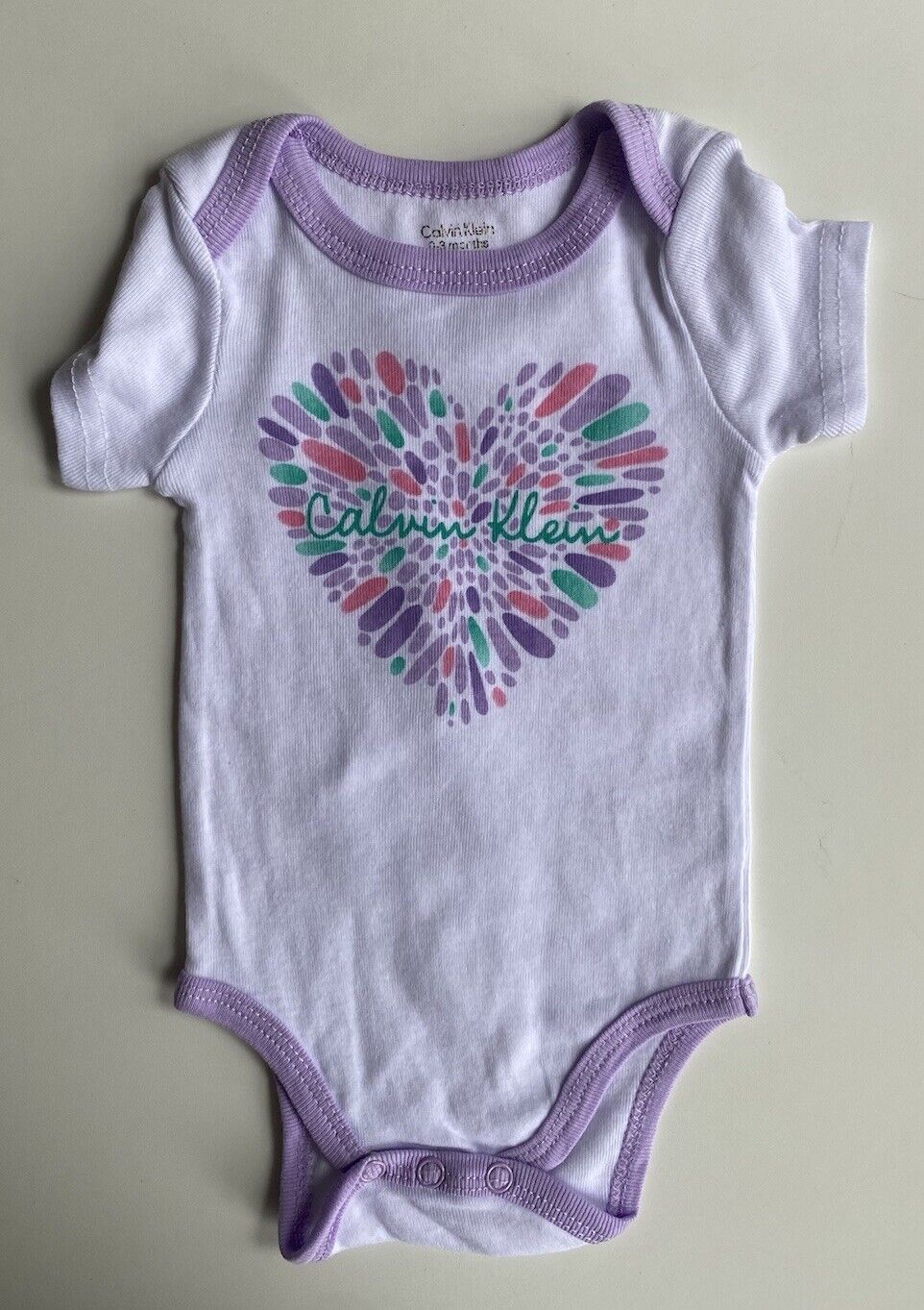 Calvin Klein baby girl size 0-3 months white purple logo heart bodysuit, VGUC