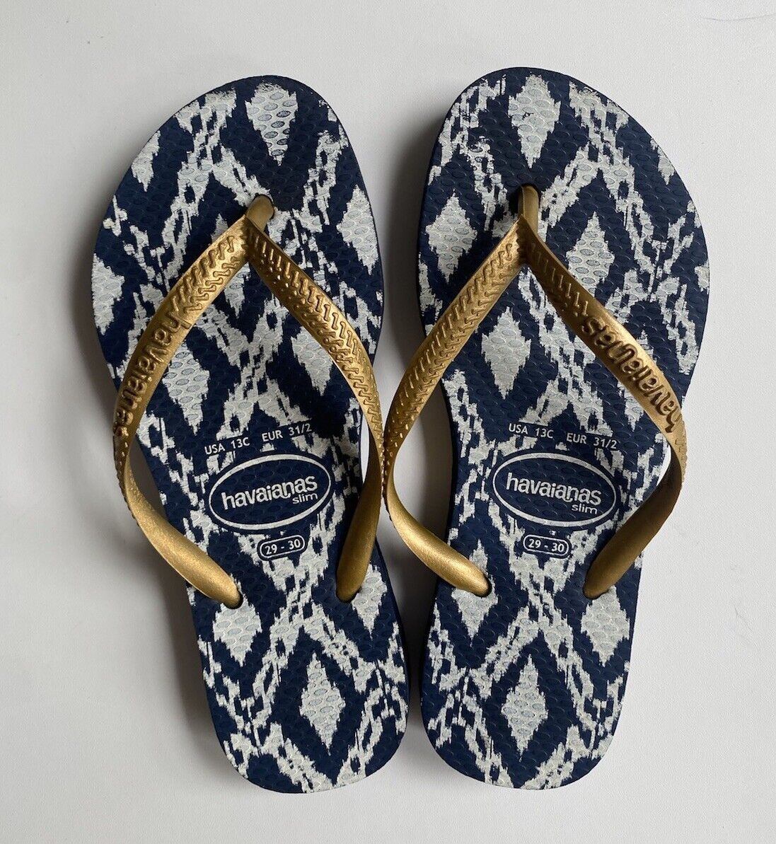 Blue and gold flip flops online