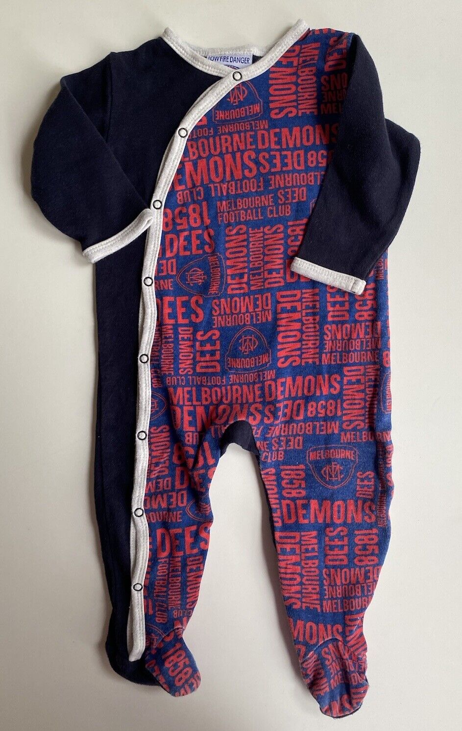 AFL Melbourne Demons baby size 6-12 months navy blue red one-piece, VGUC